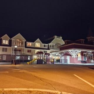 A beautifully lit hotel facade at night.