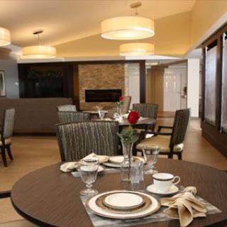 A modern dining room with elegant table settings and stylish decor.