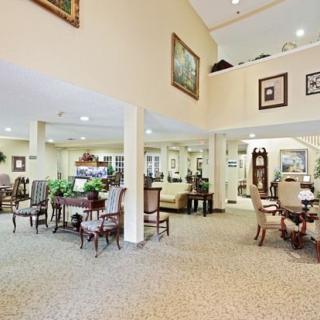 Spacious lobby area with elegant furniture and decor.
