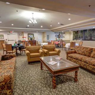 A cozy living room with comfortable seating and warm lighting.