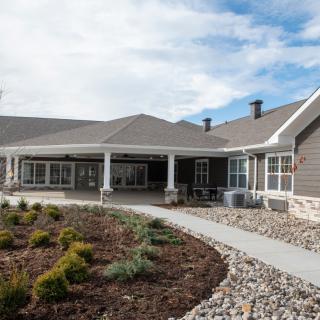 A modern residential house with landscaped yard and pathway.
