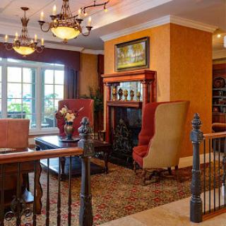 A cozy and inviting lobby with elegant furniture and a warm atmosphere.