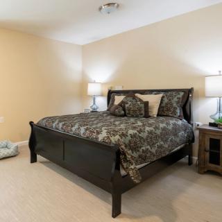 A cozy bedroom with a comfortable bed and elegant decor.