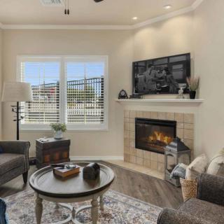 A cozy living room with a fireplace and modern decor.