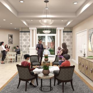 A cozy lobby with people engaging in conversation and modern decor.