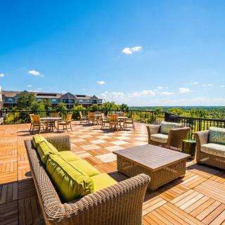 Spacious outdoor terrace with comfortable seating and scenic views.