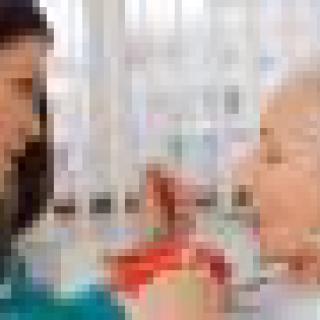 A doctor consulting with a patient in a clinical setting.