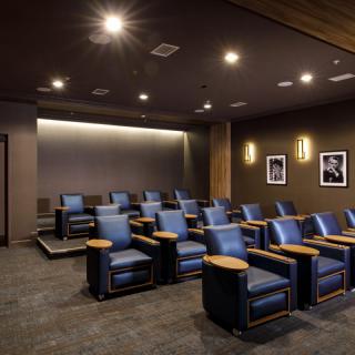 A luxurious home theater with comfortable seating and ambient lighting.