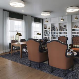 A cozy library with comfortable seating and well-organized bookshelves.