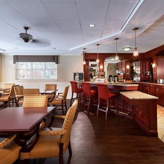 An inviting dining area with a bar and comfortable seating arrangements.