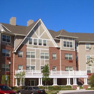 A multi-story apartment building showcasing modern architectural design.