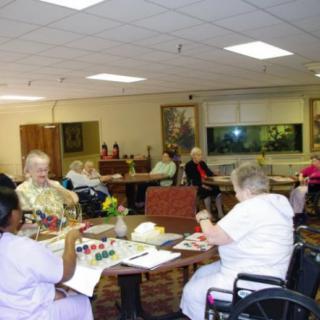 Elderly residents engaged in activities at a nursing home.