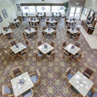 An overhead view of a dining room with neatly arranged tables and chairs.