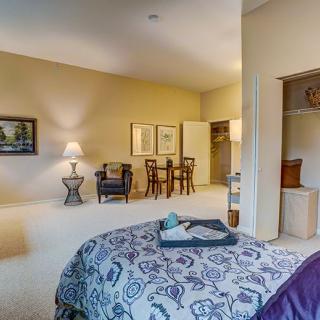 Spacious bedroom with elegant furniture and a cozy ambiance.