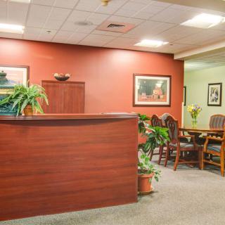 A welcoming office reception area with seating and decor.