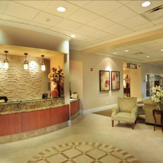 A modern reception and waiting area with stylish furnishings.
