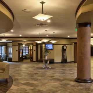 A spacious and modern hotel lobby with elegant lighting and comfortable seating.