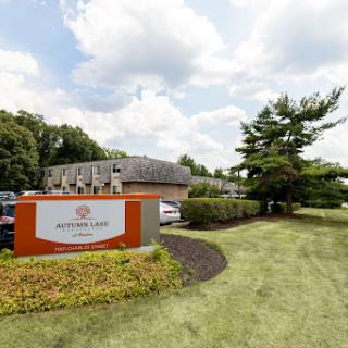 A well-maintained hotel exterior with a prominent signage and landscaped surroundings.