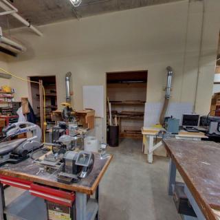 A well-equipped workshop with various tools and machines for industrial use.