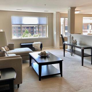 A bright and modern living room with a comfortable seating area.