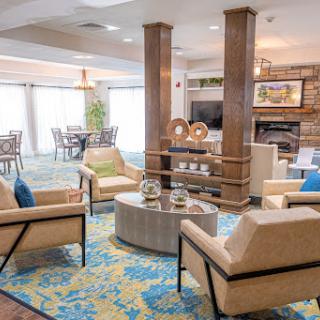 A beautifully designed lounge area featuring comfortable seating and modern decor.