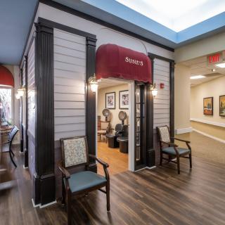 A cozy salon entrance with seating and inviting decor.