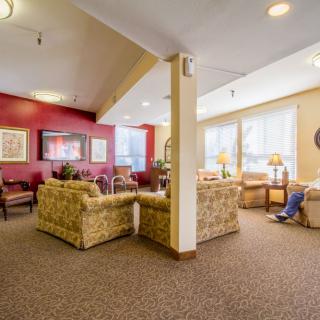 A cozy living room with comfortable seating and ample natural light.