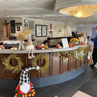 A beautifully decorated reception area showcasing seasonal autumn decor.