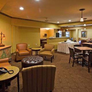 A cozy hotel lobby with comfortable seating and warm lighting.