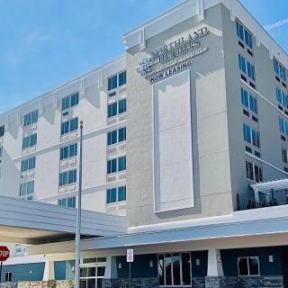 A modern hotel building with a sleek exterior design.