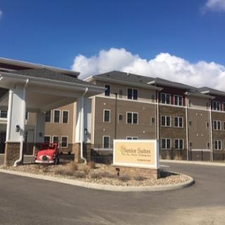 A modern residential building with a welcoming entrance and clear signage.