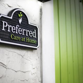 A signage for 'Preferred Care at Home' showcasing the business's focus on home healthcare services.