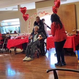 A joyful community event celebrating togetherness with decorations and balloons.