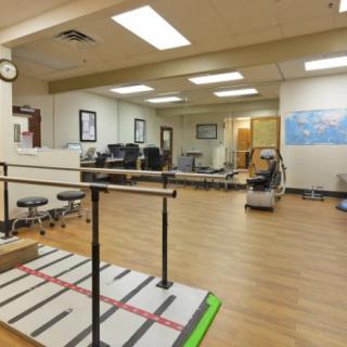 A rehabilitation clinic equipped with exercise machines and therapy tools.