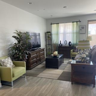 A cozy living room with modern furniture and decor.