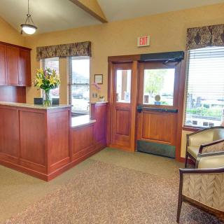 A welcoming reception area with a desk and seating.