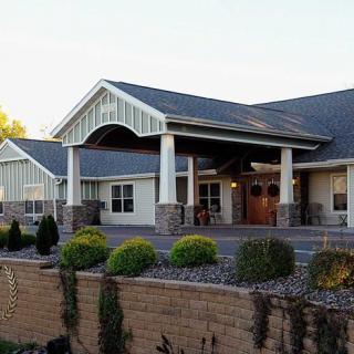 A large building with a welcoming entrance and well-maintained landscaping.