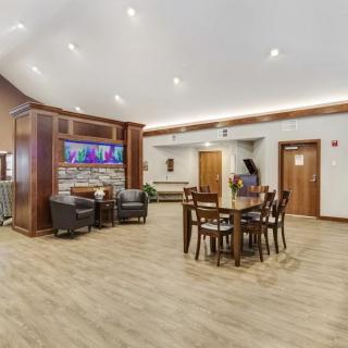 A modern lobby with comfortable seating and elegant wood flooring.