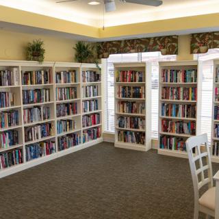 A cozy library corner with bookshelves filled with books.