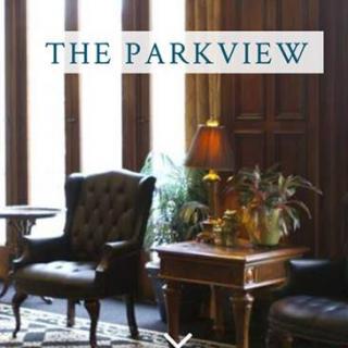 A cozy interior setting featuring classic furniture and warm lighting in The Parkview.