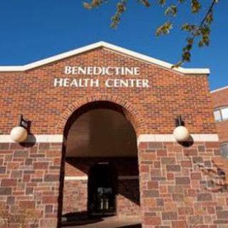 The Benedictine Health Center, showcasing a welcoming entrance with a brick facade.