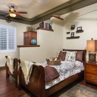 Cozy bedroom with wooden furniture and earth-toned decor.