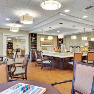 A well-lit dining area with modern tables and chairs, featuring a cozy and inviting atmosphere.
