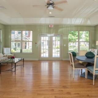 A spacious interior featuring a cozy living and dining area with plenty of natural light.