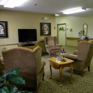 A cozy living room with comfortable seating and a television.