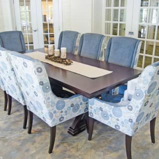 Elegant dining room with a wooden table and patterned chairs.