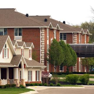 A view of a suburban neighborhood featuring a blend of architectural styles in the buildings.