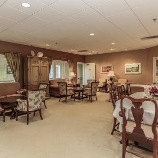 A cozy living room with traditional decor and comfortable seating arrangements.