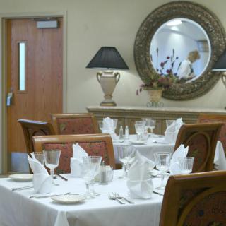 Elegant restaurant interior with neatly arranged tables and decorative elements.