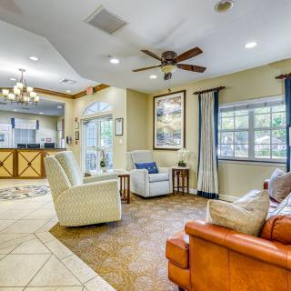 A cozy living room with comfortable seating and natural lighting.